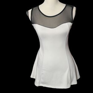 White black sleeveless peplum high low top